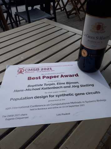 best paper award and bottle of wine.